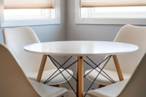 a white table and chairs in a room at Summit Unit 1103 in Granby