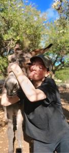a young man holding the side of a cow at Vittò in Martina Franca +47 photos