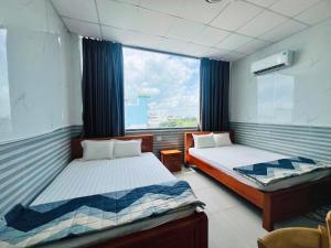 Postelja oz. postelje v sobi nastanitve Hotel Sen Việt Bạc Liêu