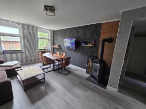 TV a/nebo společenská místnost v ubytování Havel Suites