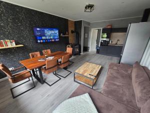 TV a/nebo společenská místnost v ubytování Havel Suites