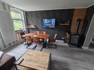 TV a/nebo společenská místnost v ubytování Havel Suites