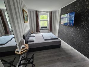 Postel nebo postele na pokoji v ubytování Havel Suites
