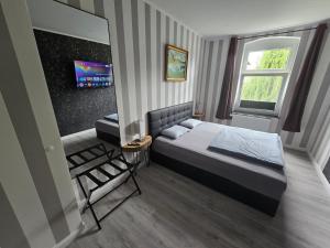 Postel nebo postele na pokoji v ubytování Havel Suites