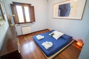 Ένα ή περισσότερα κρεβάτια σε δωμάτιο στο Le Nostre Camere Un Rifugio Personale