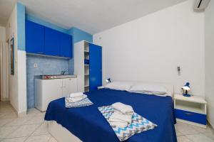 Postel nebo postele na pokoji v ubytování Apartments Tasa