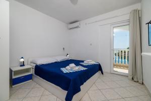 Postel nebo postele na pokoji v ubytování Apartments Tasa