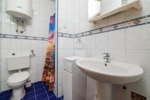 Koupelna v ubytování Apartments Tasa