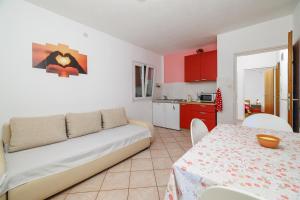 Kuchyň nebo kuchyňský kout v ubytování Apartments Tasa