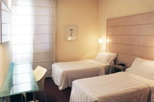 Postel nebo postele na pokoji v ubytování B&B HOTEL First