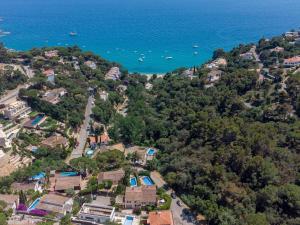 an aerial view of a resort and the ocean at Villa Montemar in Tossa de Mar