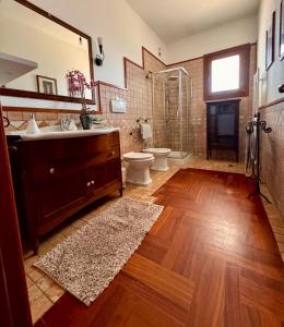 a bathroom with a sink and a toilet and a shower at Villa Erika in Gallipoli +6 photos