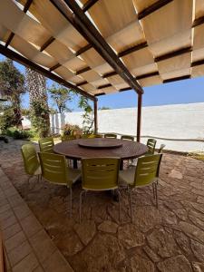 a table and chairs sitting under a pergola at Villa Erika in Gallipoli
