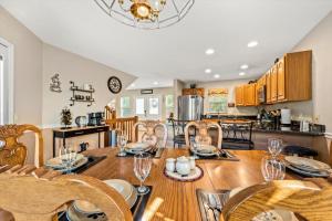 a kitchen and dining room with a table and chairs at Mountains 4 Miles By Avada Properties in Gatlinburg