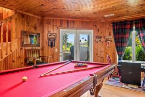 a pool table in a room with wooden walls at Mountains 4 Miles By Avada Properties in Gatlinburg