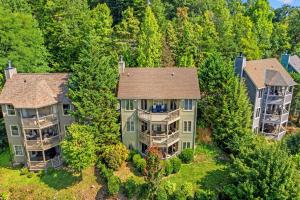 an aerial view of a large house with trees at Mountains 4 Miles By Avada Properties in Gatlinburg