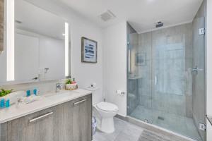 a bathroom with a shower and a toilet and a sink at City Views Studio Downtown Miami in Miami +11 photos