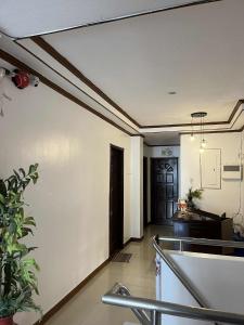 an empty room with a hallway with a door at The Birrells Boracay by Cassy in Boracay