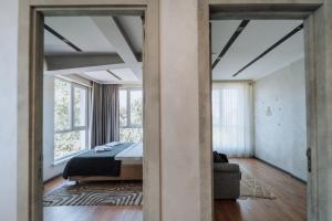 Ένα ή περισσότερα κρεβάτια σε δωμάτιο στο NEW Chic & Cozy 2-Rooms near Park in Chisinau