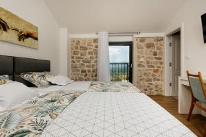 Postel nebo postele na pokoji v ubytování Vila Đirada