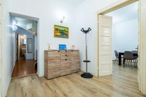 a room with a dresser and a dining room at Villa Dumbrava Rosie in Constanţa