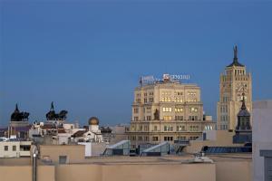 a view of buildings from the roofs of a city at NH Collection Madrid Suecia in Madrid