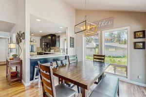 a dining room and kitchen with a wooden table and chairs at 8 Dixie Mountain Lane in Sunriver