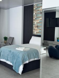 Postel nebo postele na pokoji v ubytování Sky Suite