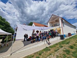 a group of people standing outside of a house at Apartmány Kutěj in Mutěnice