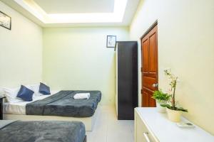 Pool Villa Near Jomtien Beach on Thep Prasit Road房間的床