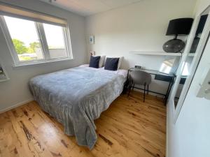 Postel nebo postele na pokoji v ubytování Hygge apartament