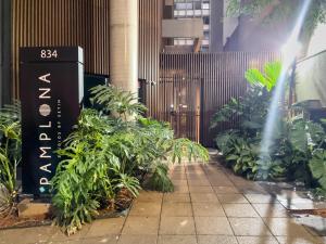 a bunch of plants in front of a building at Setin Pamplona - Studios por temporada in Sao Paulo
