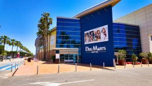 a blue building with a sign on the side of it at Cactus Apartment La Ribera in Santiago de la Ribera
