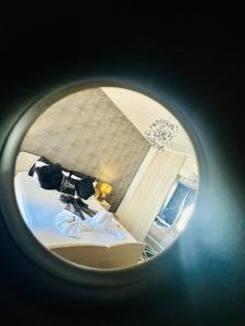 a view of a bedroom through a round window at Couple's Getaway in Is-Swieqi