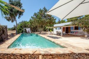 an image of a swimming pool in a house at Casa Mayo in Sant Francesc Xavier
