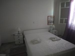 Postel nebo postele na pokoji v ubytování Epicharis Studios