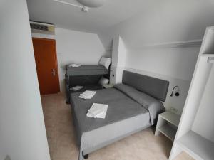 Postel nebo postele na pokoji v ubytování Hotel DOLCEVITA Park & Beach included