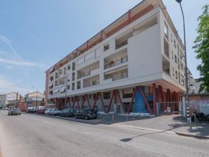 a large white building on the side of a street at Spazio Breda - Free Parking, Private Garage, Metro M1, Balcony, 4 Guests in Milan