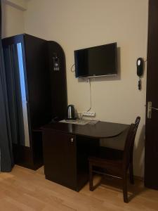 TV a/nebo společenská místnost v ubytování Hotel New Terrace
