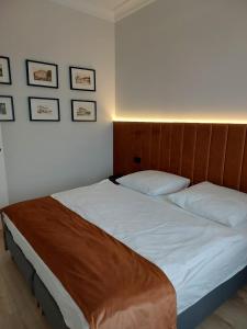 Posteľ alebo postele v izbe v ubytovaní Apartamenty Toszeckie LUX