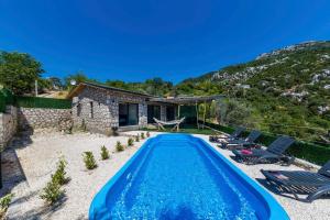 a villa with a swimming pool and a house at VillaVista07 in Kaş