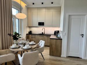 Kuchyňa alebo kuchynka v ubytovaní Apartamenty Toszeckie LUX + 10 fotografií
