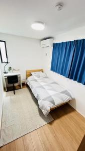 Ένα ή περισσότερα κρεβάτια σε δωμάτιο στο 柚子屋 新築貸切戸建旅館