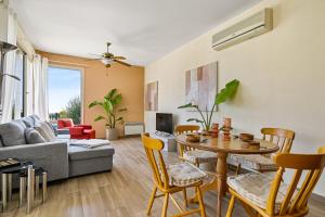 a living room with a table and chairs at Seaview Villa in Peyia with Private pool by VICHY Holidays in Paphos