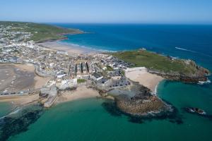 an aerial view of a small island in the ocean at Fond Memories Cottage, The Digey, St Ives in St Ives