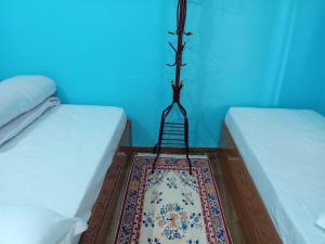 Postel nebo postele na pokoji v ubytování Sunshine homestay