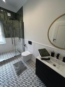 Kúpeľňa v ubytovaní Apartamenty Toszeckie LUX