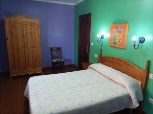Postel nebo postele na pokoji v ubytování Hotel Alonso