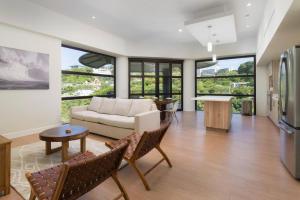 a living room with a couch and a table at La Perla 161-Oceanview,Penthouse,Walking Distance in Tamarindo