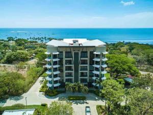 an aerial view of a hotel with the ocean in the background at La Perla 161-Oceanview,Penthouse,Walking Distance in Tamarindo